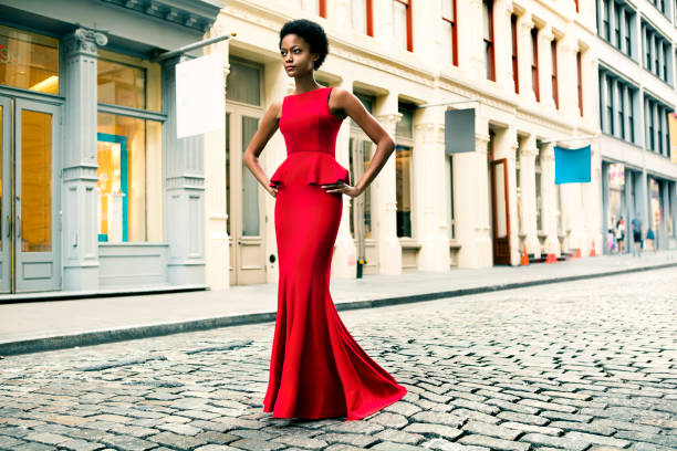 Woman wearing a red gown in Soho, New York